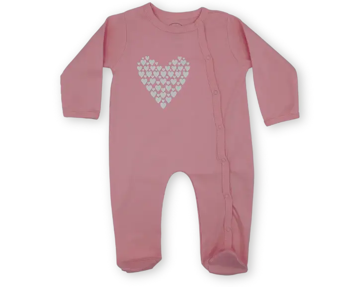 Pink baby bodysuit with white heart pattern and snap buttons, long sleeves, footed design