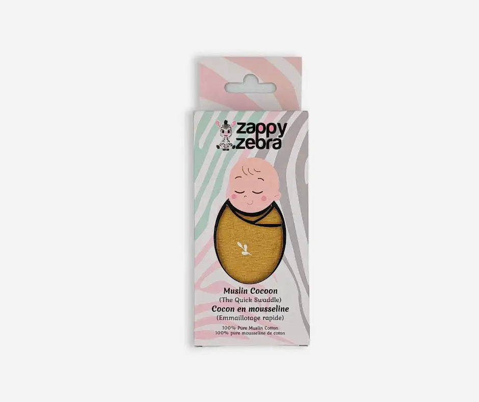 Yellow ochre muslin baby cocoon swaddle in pastel packaging, 100% cotton product display