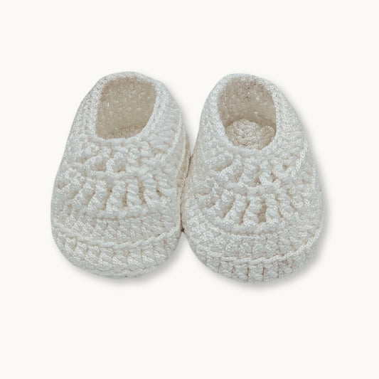 Pair of white fleece slippers on a white background